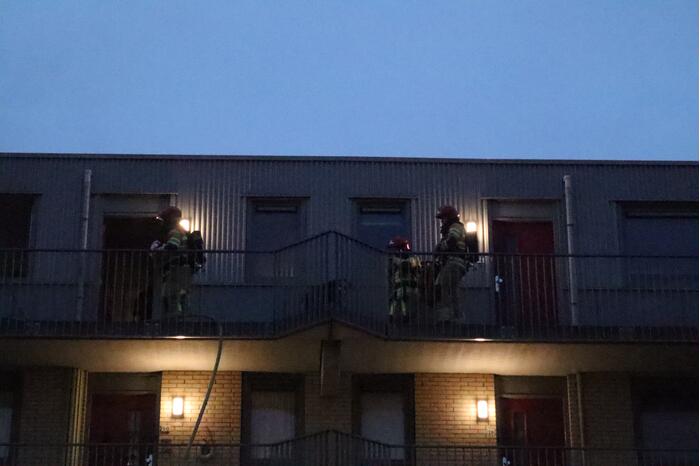 Brand in flatwoning boven winkels