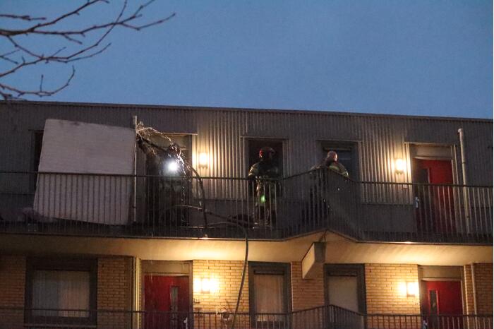 Brand in flatwoning boven winkels