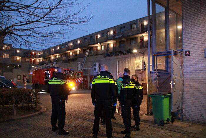 Brand in flatwoning boven winkels
