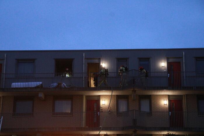 Brand in flatwoning boven winkels