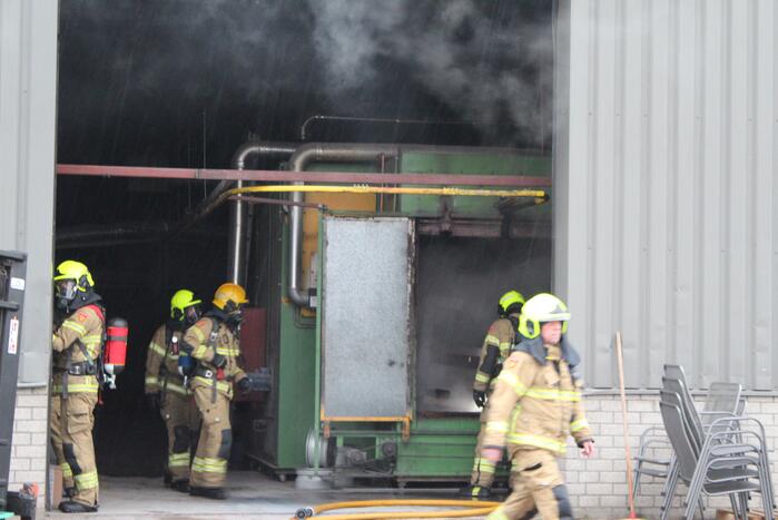 Veel rookontwikkeling na brand in machine