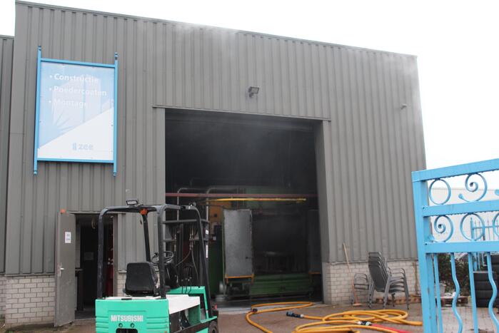 Veel rookontwikkeling na brand in machine