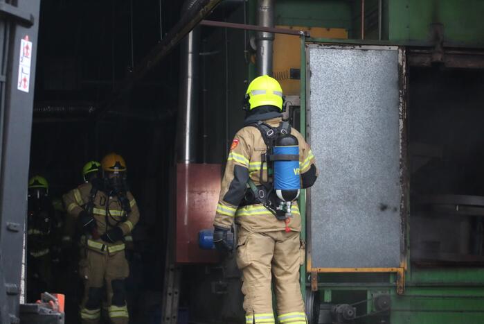 Veel rookontwikkeling na brand in machine