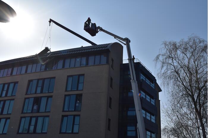Glazenwasser vast in op hol geslagen lift