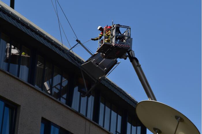 Glazenwasser vast in op hol geslagen lift
