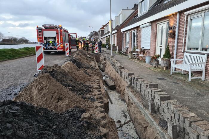Stoeptegels gevallen op leiding
