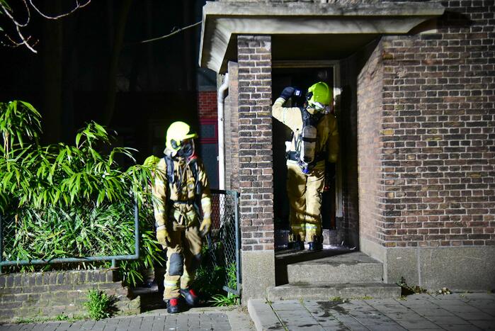 Brand in portiek van woning