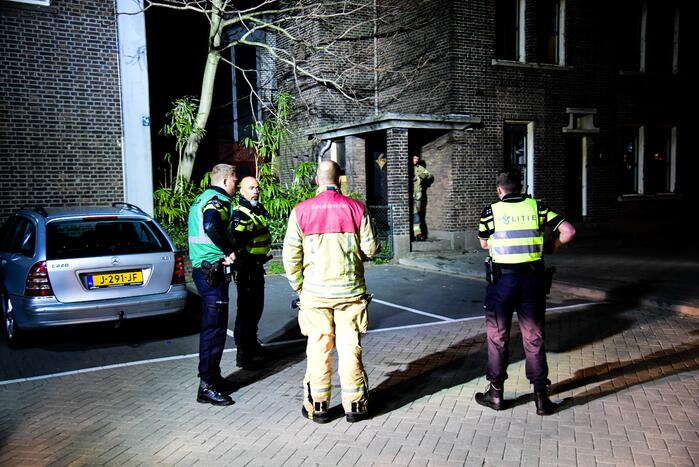 Brand in portiek van woning