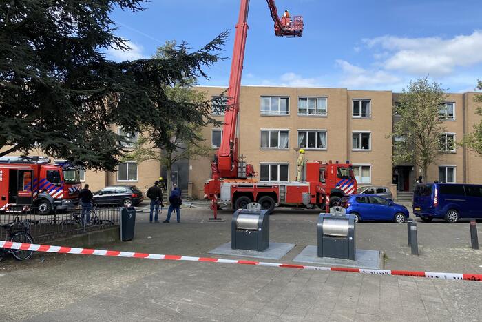 Meerdere bewoners door brand opgesloten in woningen