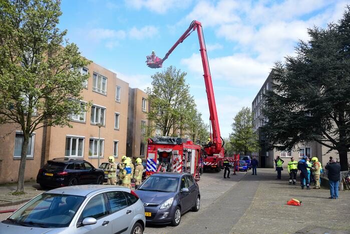 Meerdere bewoners door brand opgesloten in woningen
