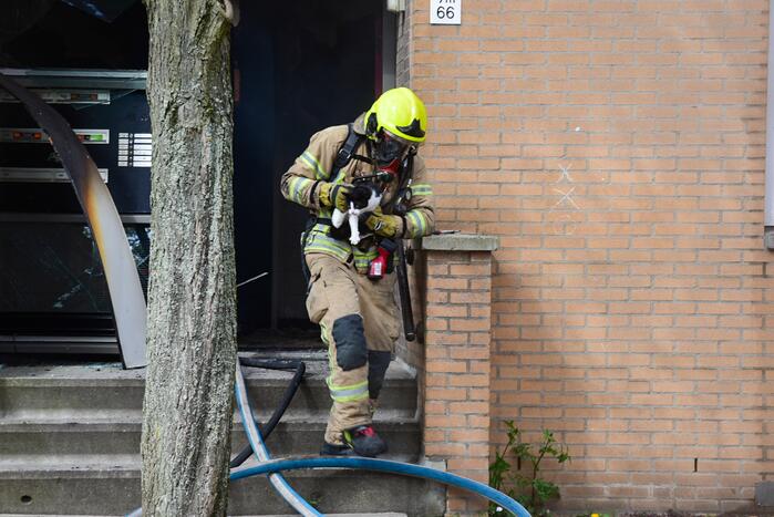 Meerdere bewoners door brand opgesloten in woningen