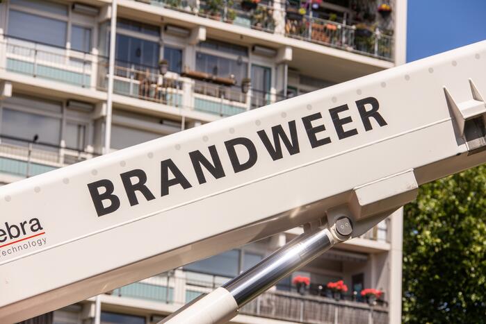 Brand in liftschacht van portiekflat