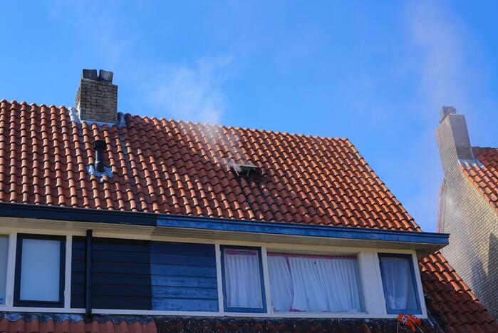 Grijze rookontwikkeling brand in woning
