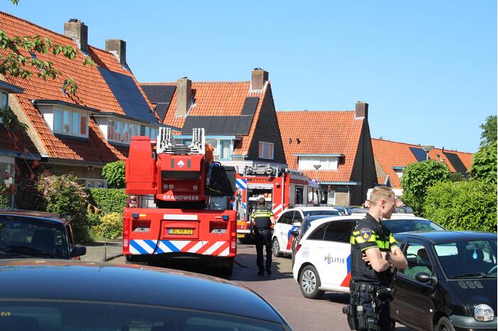 Grijze rookontwikkeling brand in woning