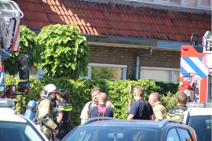 Grijze rookontwikkeling brand in woning
