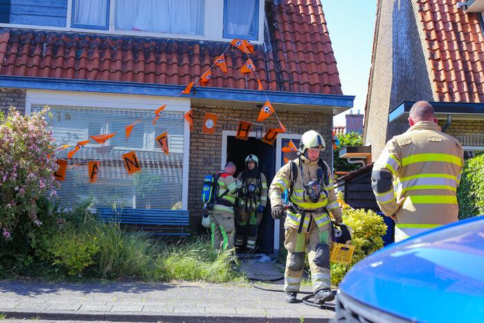 Grijze rookontwikkeling brand in woning