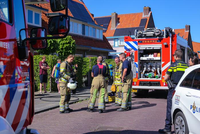 Grijze rookontwikkeling brand in woning