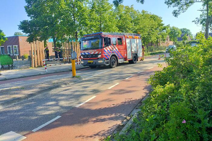 Afvalbak in brand op schoolplein