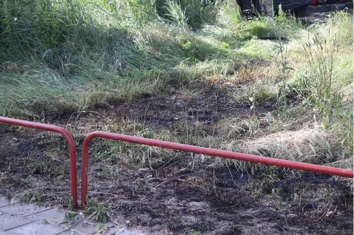 Brandweer blust bermbrand