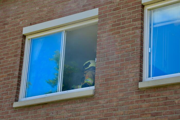 Deur woning opengeramd bij brand in woning