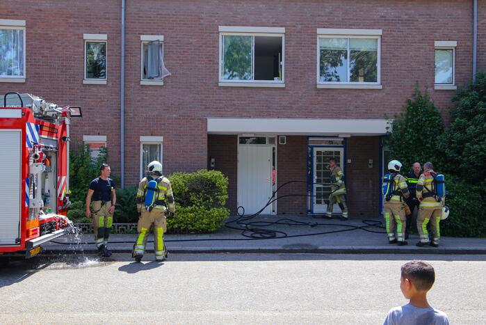 Deur woning opengeramd bij brand in woning
