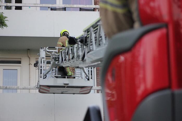 Flat deels ontruimd door brandlucht