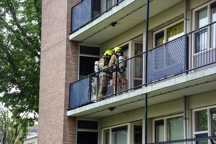 Bank in kelderruimte in brand gevlogen