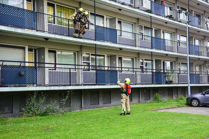 Bank in kelderruimte in brand gevlogen