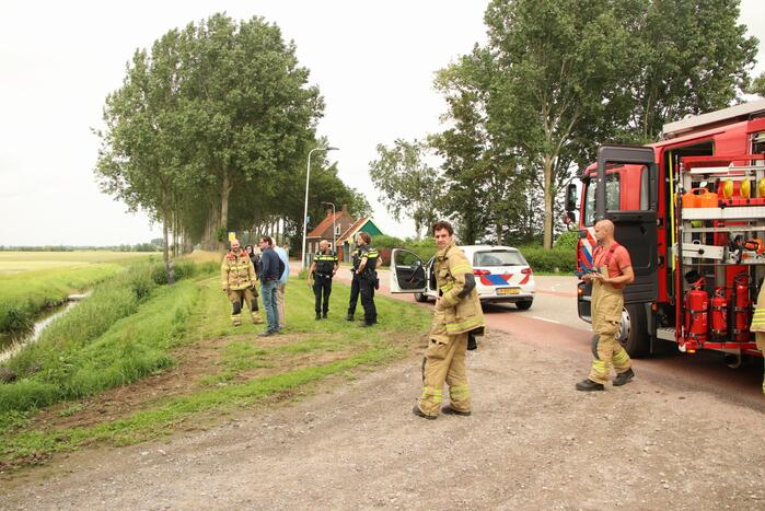 Zitmaaier gekanteld en belandt op slootrand