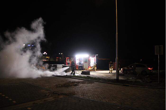 Vlammen bij brand in container