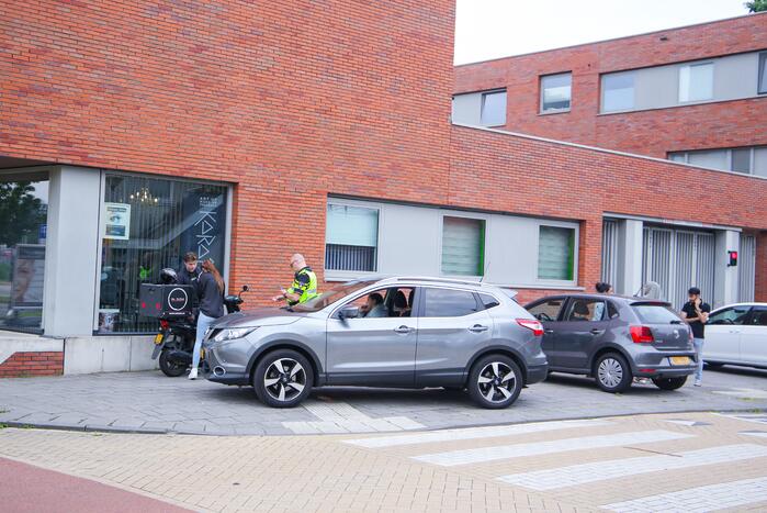 Ongeval tussen scooter en auto op kruising