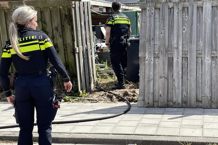 Schutting in achtertuin beschadigd door brand