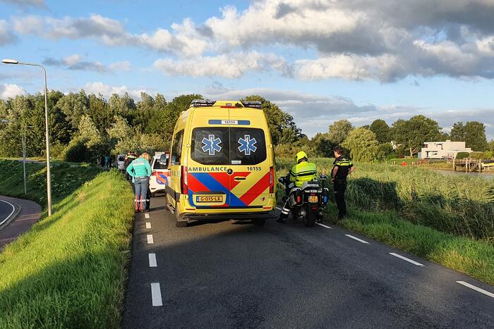 Persoon ten val met scooter