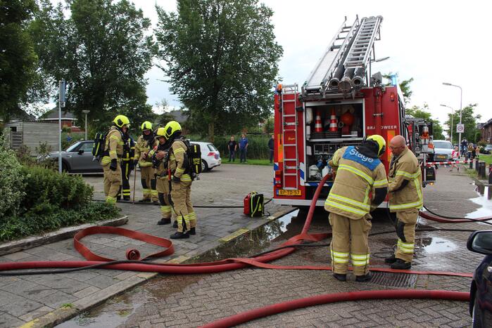 Huisdier gered bij woningbrand, bewoner gewond