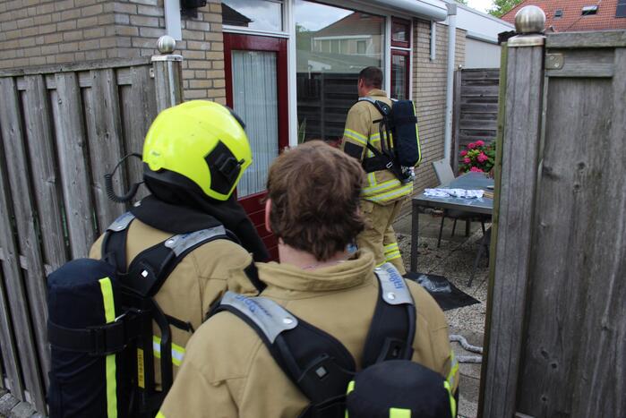 Huisdier gered bij woningbrand, bewoner gewond