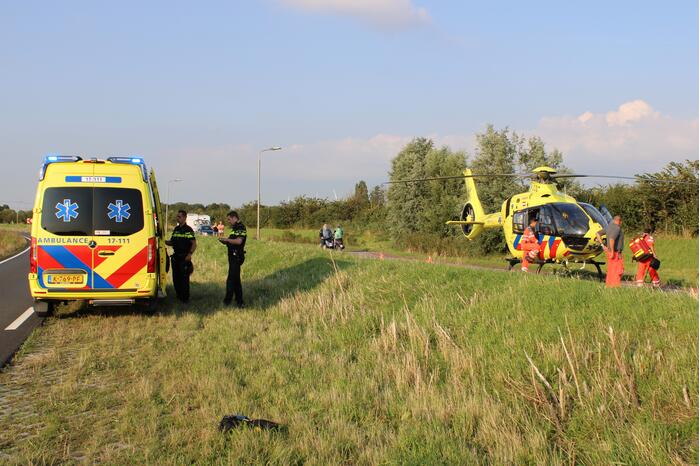 Bestuurder motorscooter gaat onderuit en raakt gewond