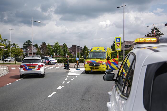 Fietsster geschept door auto