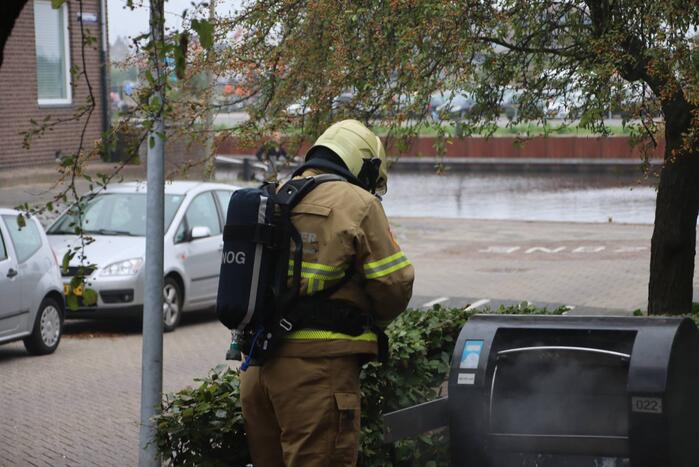 Ondergrondse container in brand