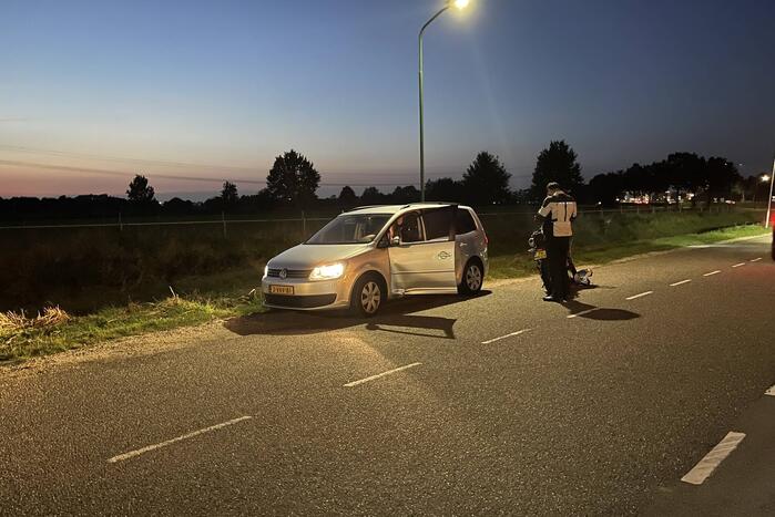 Schade bij ongeval tussen personenauto en motor