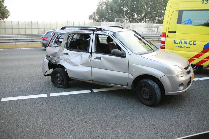 Auto in botsing met mobiele kraan