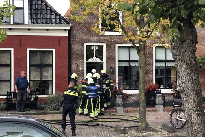 Veel rook bij keukenbrand van woning