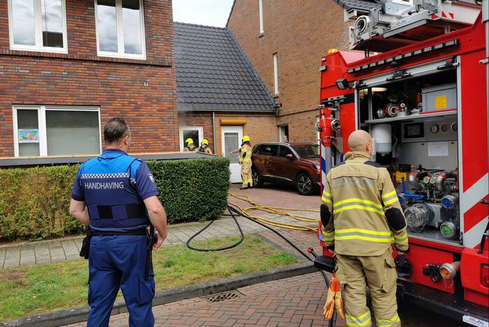 Brand in schuur naast woning