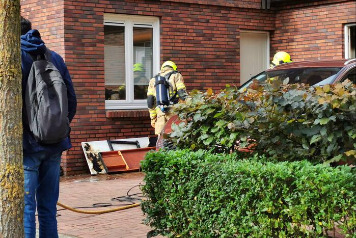 Brand in schuur naast woning