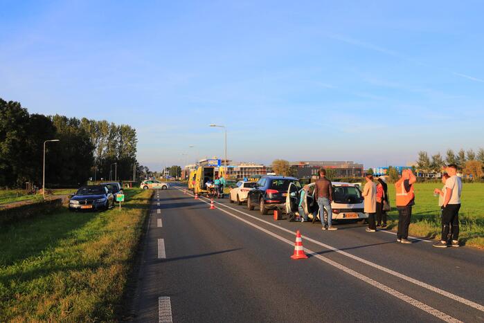 Kop-staartbotsing met lesauto