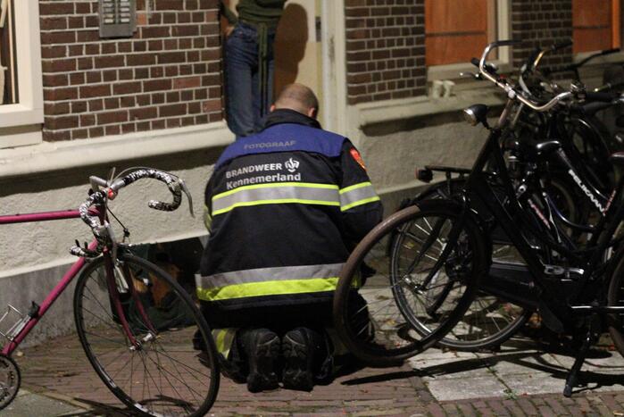 Schilderij vat vlam in woning