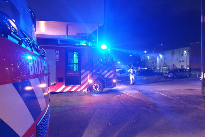 Rookontwikkeling door brand in perscontainer