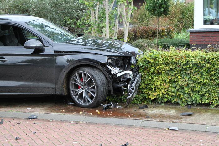 Flinke ravage bij botsing tussen auto's