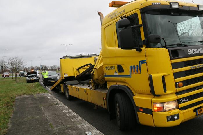 Schade bij botsing op rotonde