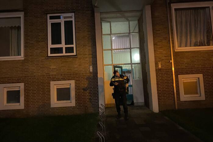 Deur ingeslagen vanwege brand