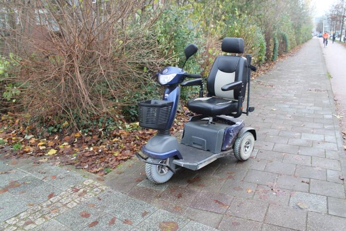 Persoon ten val met scootmobiel